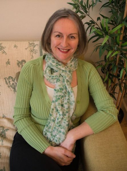 Emma Sanders Sitting On A Sofa